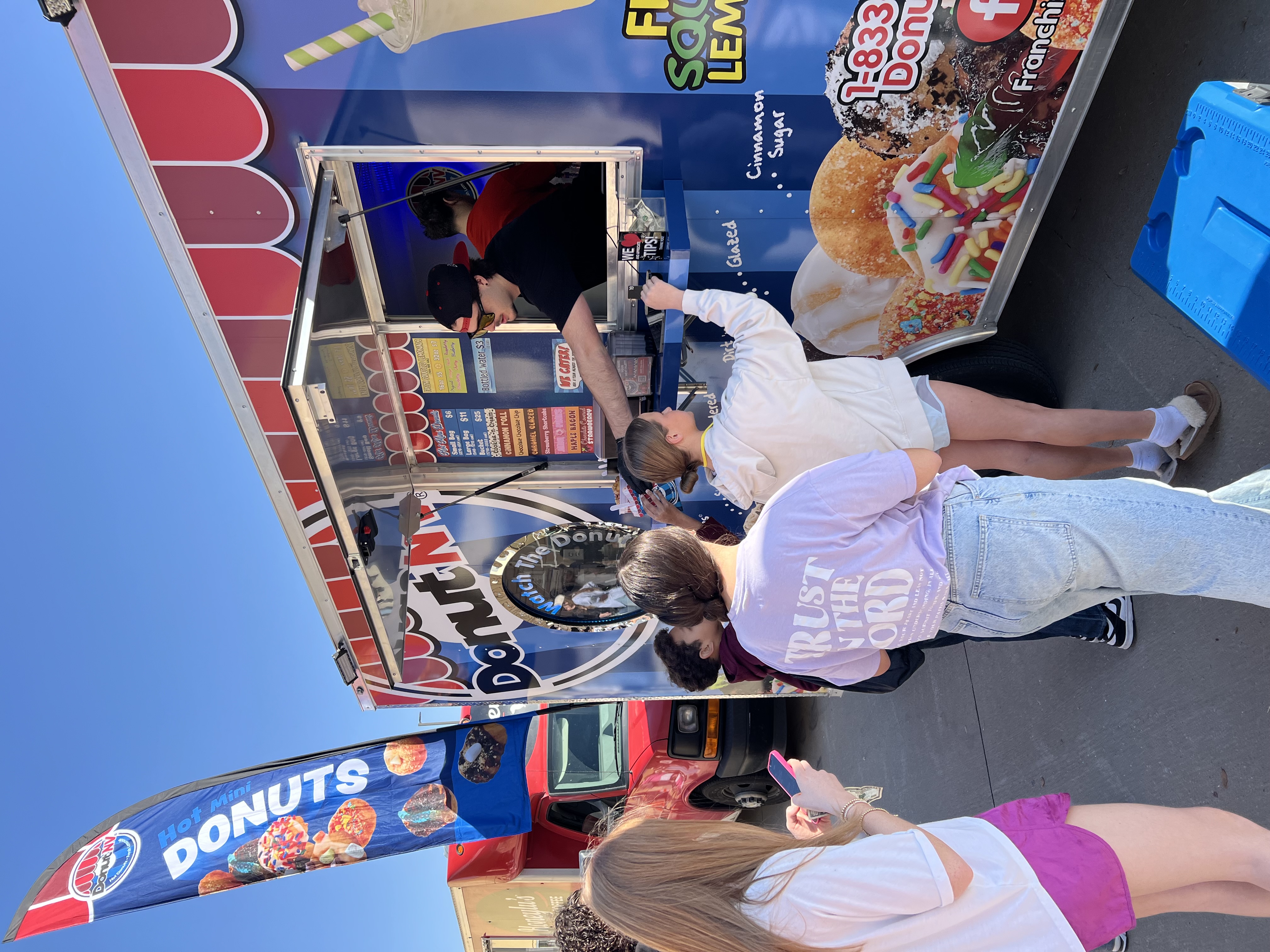 Teenagers ordering at DonutNV trailer
