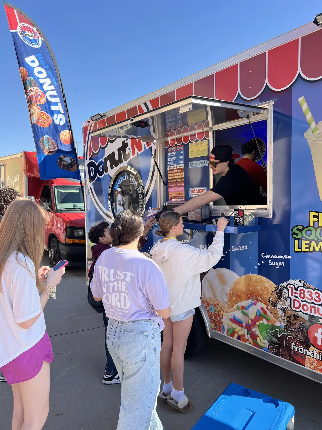 Teenagers ordering at DonutNV trailer
